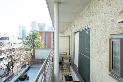 a balcony with a view of the city at NIYS apartments 55 type in Tokyo