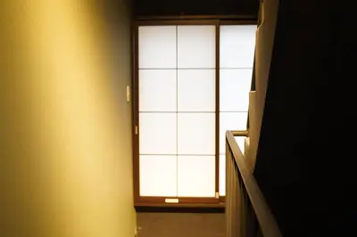 a door with a window in a room at Remon House Asakusa Tokyo in Tokyo