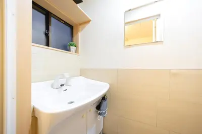 a bathroom with a sink and a mirror at -Asakusa 5chome- 12-minute walk to Asakusa Station! in Tokyo