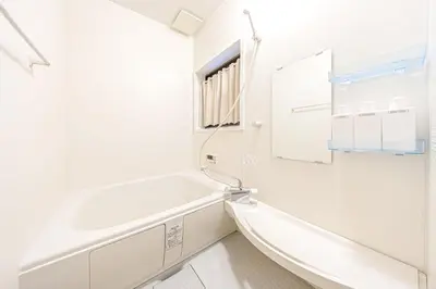 a white bathroom with a tub and a sink at -Asakusa 5chome- 12-minute walk to Asakusa Station! in Tokyo