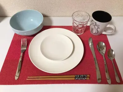 a white plate sitting on a red napkin with silverware at Yamato Heights YH22 in Tokyo
