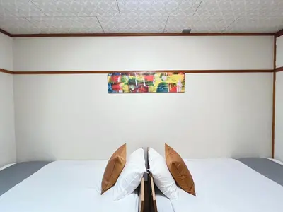 a bedroom with a bed with a pair of shoes at Yamato Heights YH22 in Tokyo