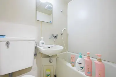 a bathroom with a sink and a bath tub next to a sink at Yamato Heights YH27 in Tokyo