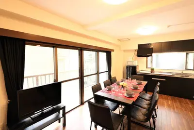 a kitchen and dining room with a table and chairs at Nishigokencho NA2 in Tokyo