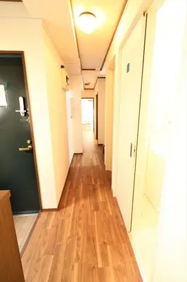 an empty hallway in an office building with wood floors at Nishigokencho NA3 in Tokyo