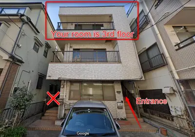 a car parked in a parking lot in front of a building at Nishigokencho NA3 in Tokyo