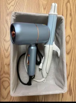 a blue flashlight and a phone in a box at \u65b0\u5bbf\u540e\u82b1\u56ed in Tokyo