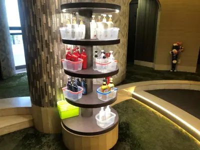 a shelf with bottles and baskets on it in a lobby at \u30db\u30c6\u30eb\u30db\u30ef\u30a4\u30c8\u30b7\u30c6\u30a323Adults only in Tokyo