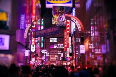 a busy city street at night with neon signs at \u30db\u30c6\u30eb\u30db\u30ef\u30a4\u30c8\u30b7\u30c6\u30a323Adults only in Tokyo