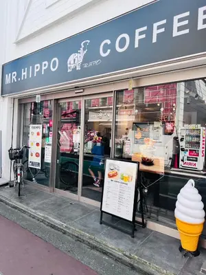 a coffee shop with a giant ice cream cone in the window at Shinjuku Suginami in Tokyo
