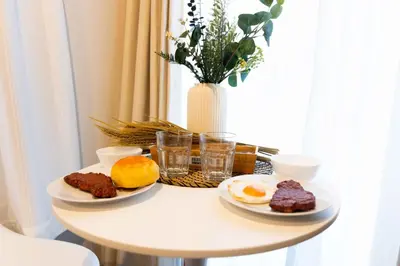 a table with two plates of breakfast food on it at FL Residence Kagura Futei II in Tokyo