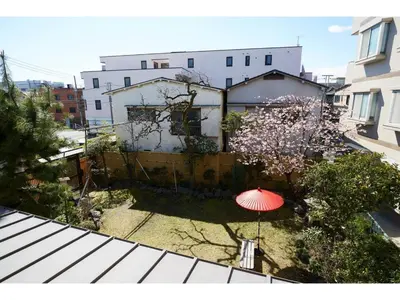 a red umbrella sitting on top of a roof at Tokyo Gu - Vacation STAY 18156 in Tokyo
