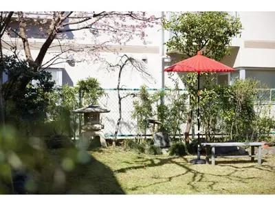 a park with a red umbrella and a bench at Tokyo Gu - Vacation STAY 18156 in Tokyo