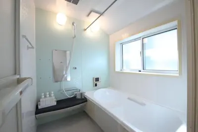 a white bathroom with a tub and a window at Urayasu Detached house UK1 in Tokyo