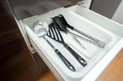 a white tray with utensils in a drawer at XS14 XROSS STAY Higashi shinjuku1 \u6771\u65b0\u5bbf in Tokyo