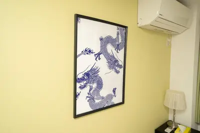 a picture of dragons hanging on a wall at XS14 XROSS STAY Higashi shinjuku1 \u6771\u65b0\u5bbf in Tokyo