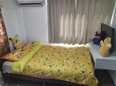 a bedroom with a bed with two stuffed animals on it at Shibuya area large Home 10m walking to Shibuya Stream Building in Tokyo