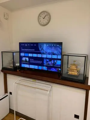 a flat screen tv sitting on top of a counter at Kinshicho detached house KK23 in Tokyo
