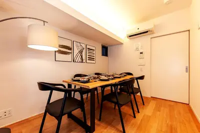 a dining room with a table and chairs at Premier suite Roppongi Tokyo in Tokyo