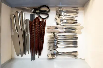a drawer filled with lots of utensils at Premier suite Roppongi Tokyo in Tokyo