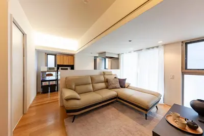 a living room with a couch and a table at Premier suite Roppongi Tokyo in Tokyo