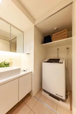 a kitchen with a refrigerator and a sink at Premier suite Roppongi Tokyo in Tokyo
