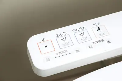 a close up of a white remote control at Nishi Shinjuku House Five 2F HF2 in Tokyo