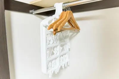 a white hanging basket on a rail in a room at Marine Cove Hatsudai by Tranova in Tokyo