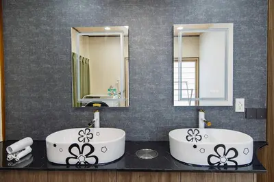 a bathroom with two sinks and two mirrors at QiQi House Tokyo Hirai Villa 2Bath3WCs 4min Station 24min to Akihabara in Tokyo