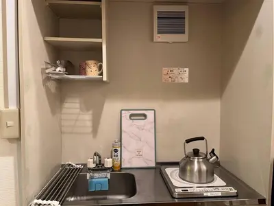 a kitchen with a sink and a tea kettle at SW Nishi Waseda 202 SN22 in Tokyo
