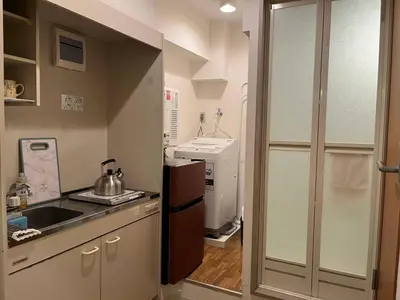 a small kitchen with a sink and a stove at SW Nishi Waseda 202 SN22 in Tokyo