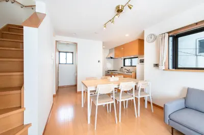 a kitchen and dining room with a table and chairs at \u5317\u6c60\u888b\u6238\u5efa in Tokyo