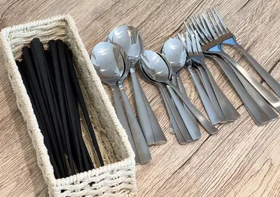 a group of silver utensils sitting on a table at \u5317\u6c60\u888b\u6238\u5efa in Tokyo