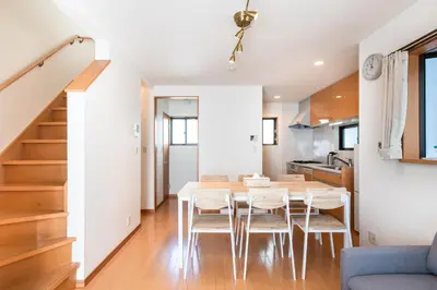 a kitchen and dining room with a table and chairs at \u5317\u6c60\u888b\u6238\u5efa in Tokyo