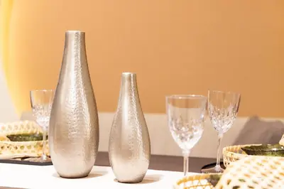 three silver vases sitting on a table with wine glasses at VISTALIA - Vacation STAY 18151 in Tokyo
