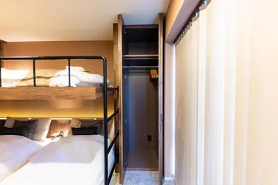 a bedroom with two bunk beds and a window at VISTALIA - Vacation STAY 18151 in Tokyo