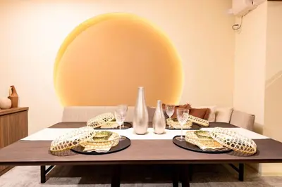 a table with sandwiches and wine glasses on it at VISTALIA - Vacation STAY 18151 in Tokyo
