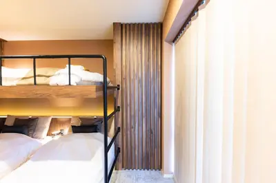a bedroom with two bunk beds and a window at VISTALIA - Vacation STAY 18150 in Tokyo