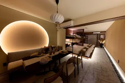 a living room with a couch and a table and chairs at VISTALIA - Vacation STAY 18150 in Tokyo