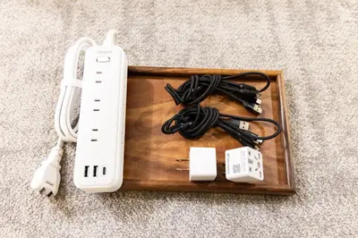 a nintendo wii controller and other electronics on a wooden tray at VISTALIA - Vacation STAY 18152 in Tokyo