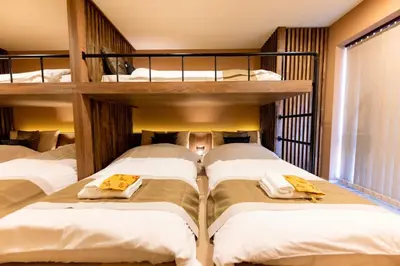 two bunk beds in a room with white beds at VISTALIA - Vacation STAY 18153 in Tokyo