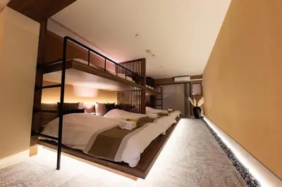 a bedroom with two bunk beds and a staircase at VISTALIA - Vacation STAY 18153 in Tokyo