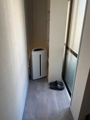 a small appliance sitting in a hallway next to a window at Kobayashi Building - Vacation STAY 82335v in Tokyo