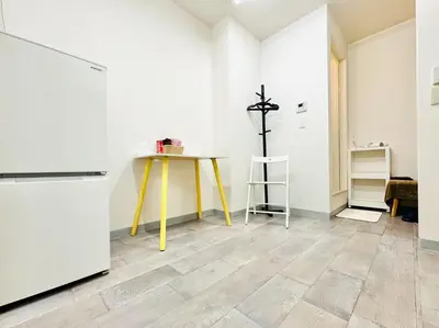 a kitchen with a yellow table and a refrigerator at Kobayashi Building - Vacation STAY 82335v in Tokyo