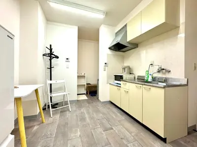 a kitchen with white cabinets and a counter top at Kobayashi Building - Vacation STAY 82335v in Tokyo