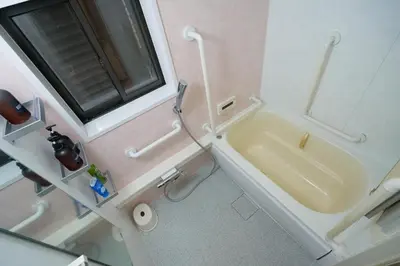 a bathroom with a sink and a bath tub at yoyogi house jellyne in Tokyo