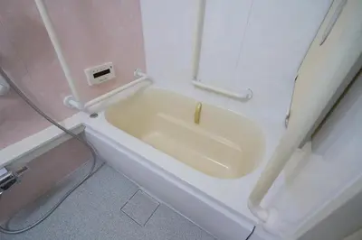 a bath tub in a bathroom with a sink at yoyogi house jellyne in Tokyo