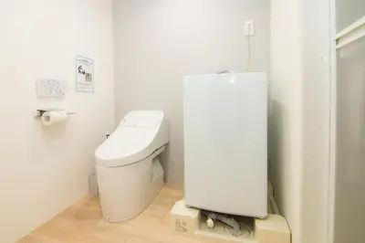 a bathroom with a toilet in a room at HW HILLS Komagome 101 by Tranova in Tokyo