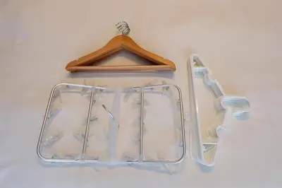 a glass plate hanging on a wall with a hanger at Kimura House by Tranova in Tokyo