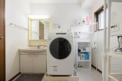 a washing machine in a bathroom with a sink at Tokyo Kitasen 4 in Tokyo